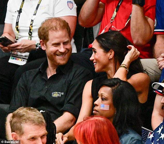 The Sussexes smile at eachother and both were in high spirits last night