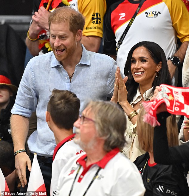 The Duchess of Sussex, 42, opted for a monochrome ensemble in the two tones of off-white when attending a seated volleyball match in Dusseldorf, Germany , with the Duke, who turns 39 today