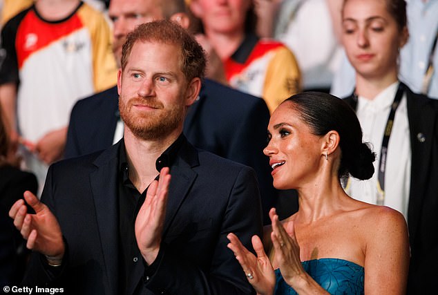 The couple chat as they watch the closing ceremony which celebrated the 6th Invictus Games in Dusseldorf