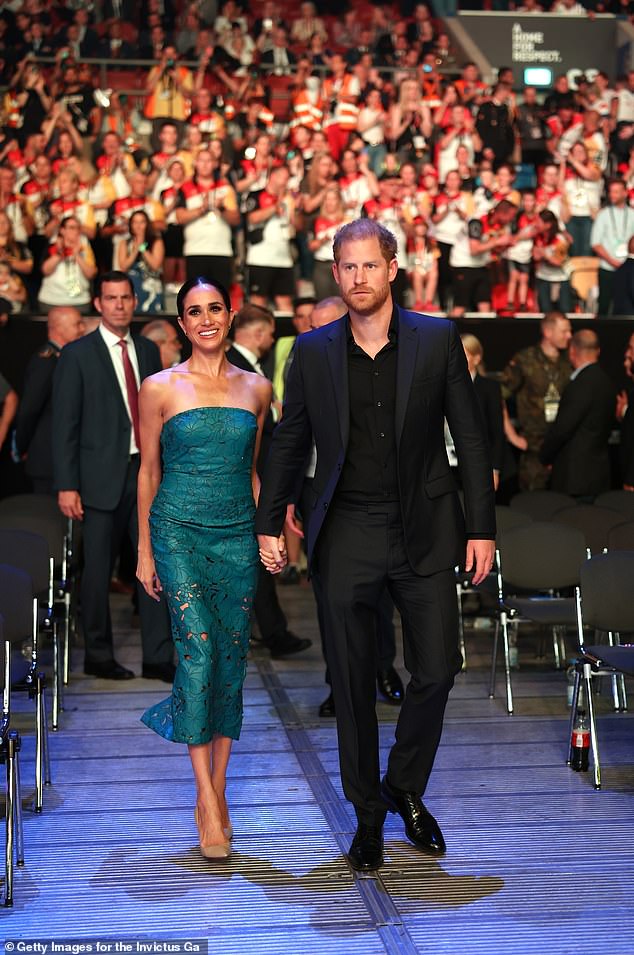 Duke and Duchess of Sussex attend the closing ceremony of the Invictus Game in Dusseldorf hand-in-hand