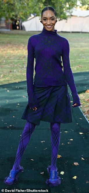 Stunning: Jourdan Dunn wowed in an all-blue ensemble which consisted of a knitted jumper, a tartan skirt and tights