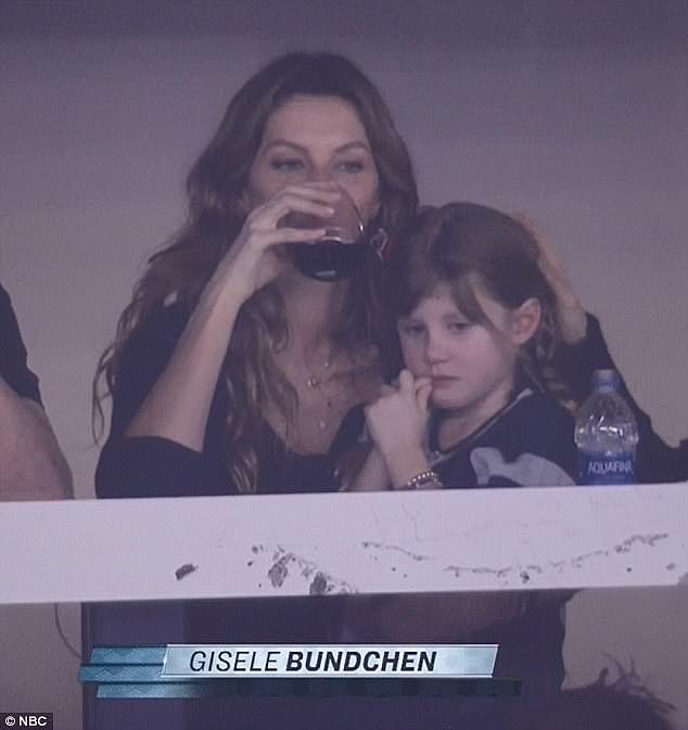 Red wine moment: Gisele previously took comfort in alcohol - famously getting caught on camera drinking in the VIP suite at US Bank Stadium in Minneapolis as she watched the 46-year-old seven-time Super Bowl champ's team lose to the Philadelphia Eagles in 2018