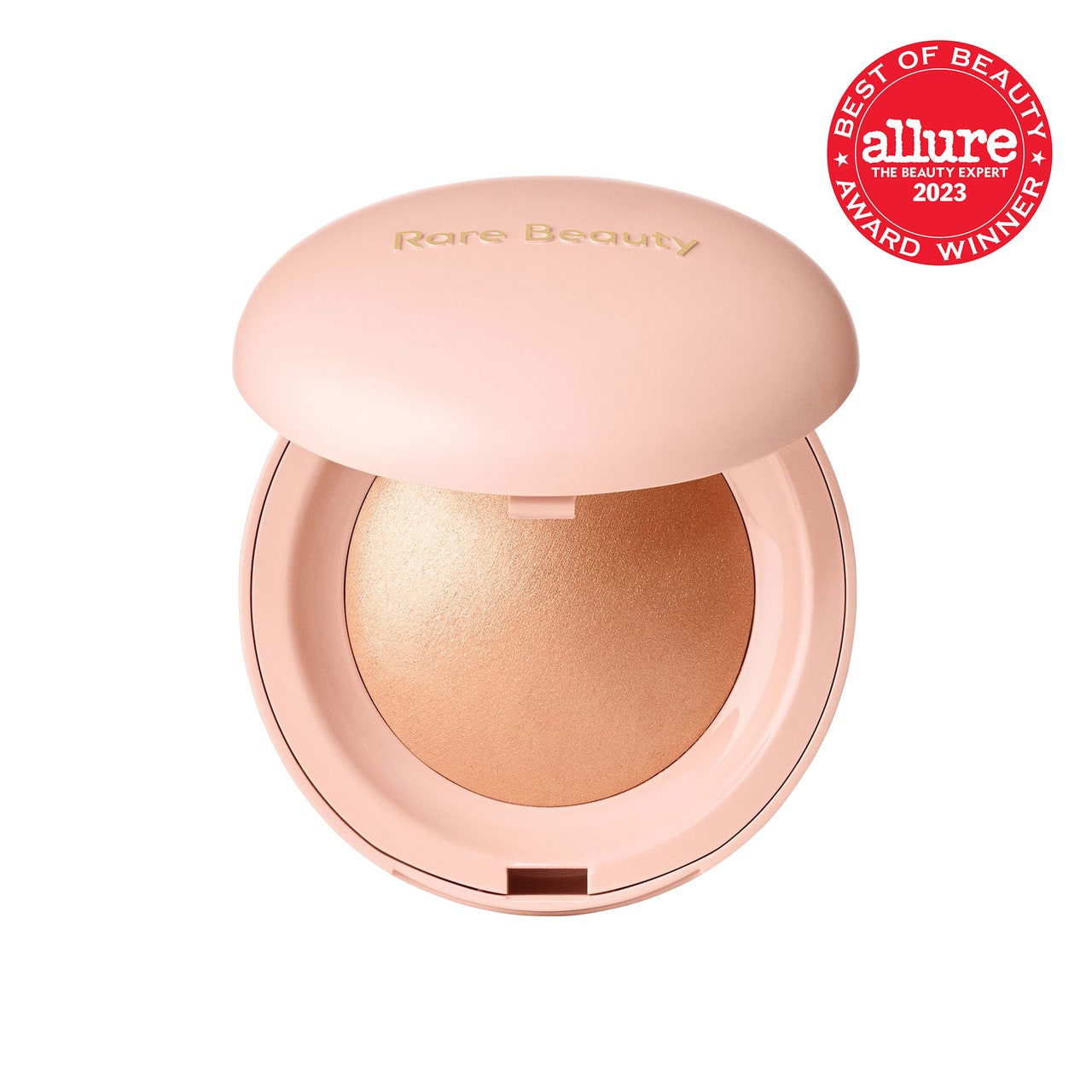 Rare Beauty Positive Light Silky Touch Highlighter pale pink compact of gold champagne powder highlighter on white background with red Allure BoB seal in the top right corner