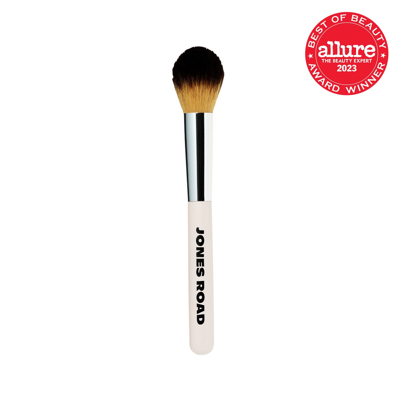 Jones Road The Blush Brush white and silver fluffy brush with black and brown bristles on white background with red Allure BoB seal in the top right corner
