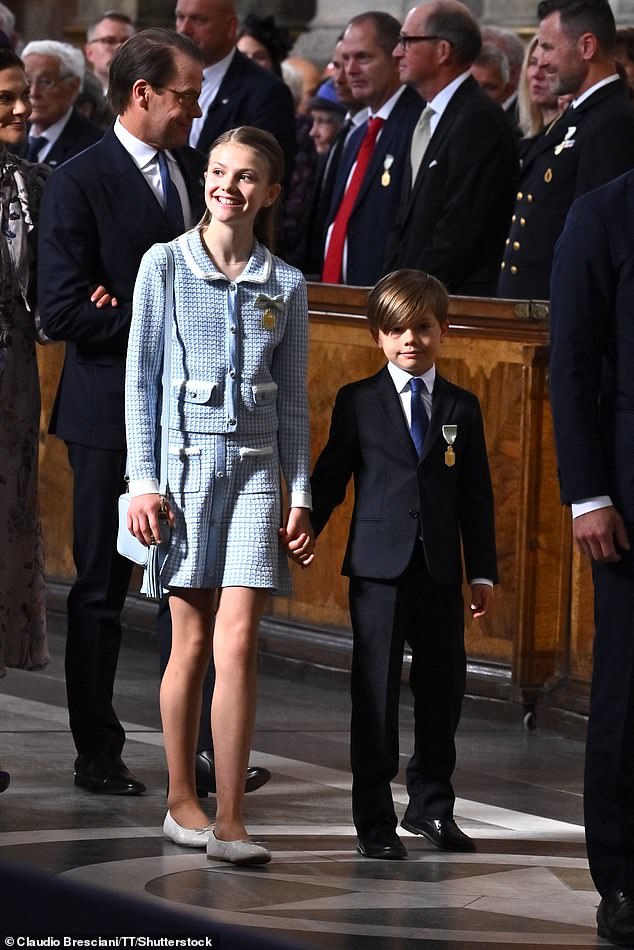 Sweden's Prince Oscar, seven, and Princess Estelle, eleven entered the Te Deum hand in hand with one another