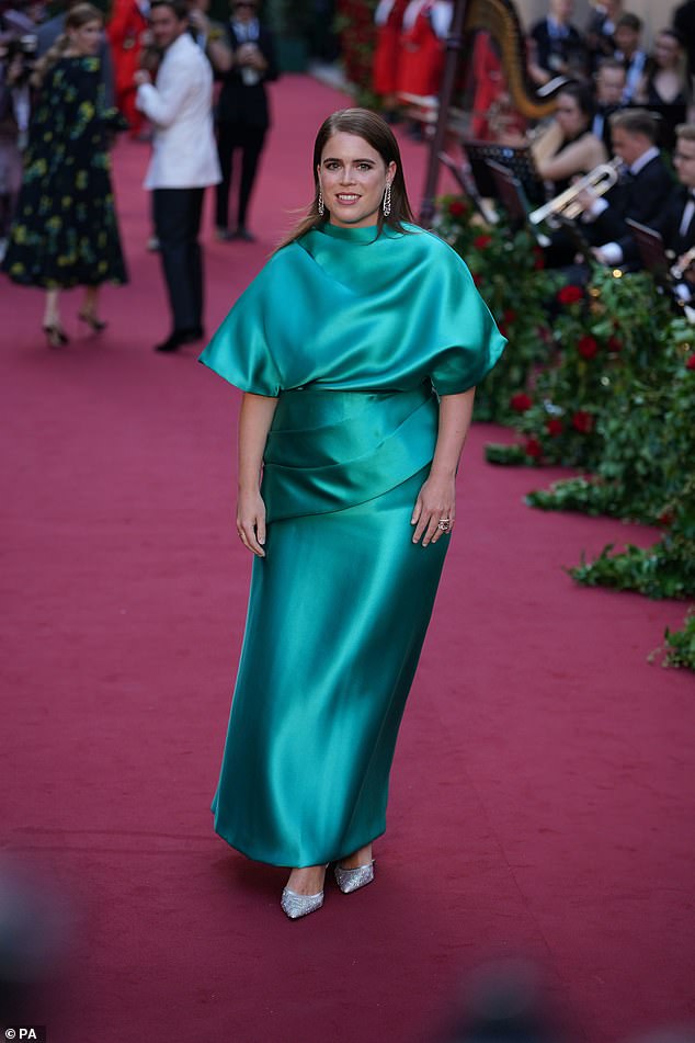 For the occasion, Eugenie opted for a turquoise satin dress, fit with pleated detailing and short sleeves