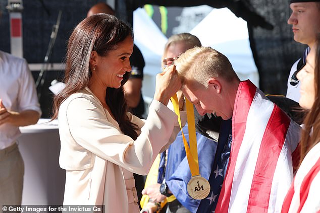 Meghan couldn't help but grin as she met with the American stars