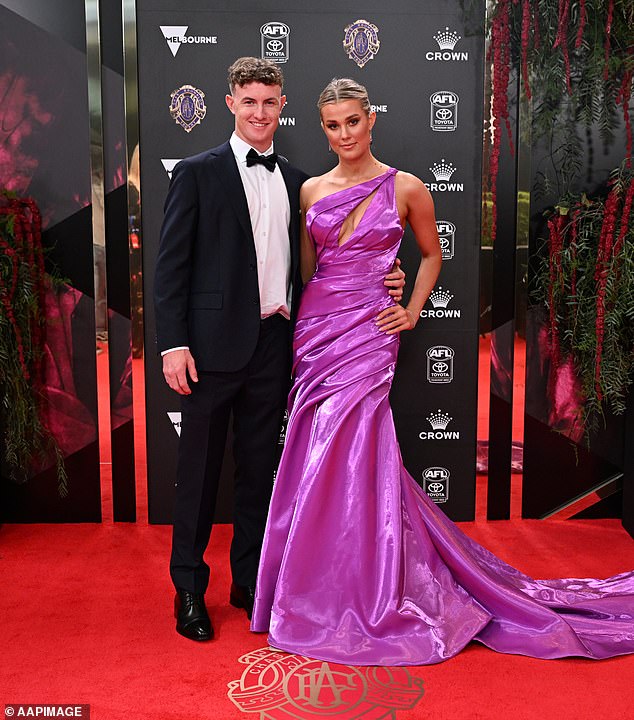 Sydney Swans player Chad Warner had his date Alice Hughes on his arm, with the footballer handsome in a tux