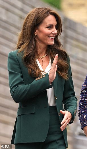 The royal mother-of-three offered a wave to royal fans who were awaiting her arrival at the textile mill