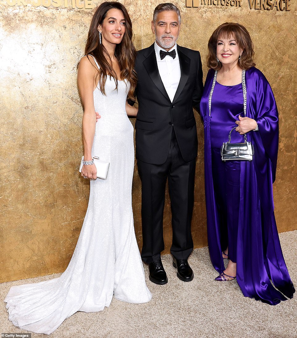 Family photo: As they posed up a storm in front of the event's gold backdrop, they mingled with some of the other attendees, including Amal's mother, the Lebanese journalist Baria Alamuddin