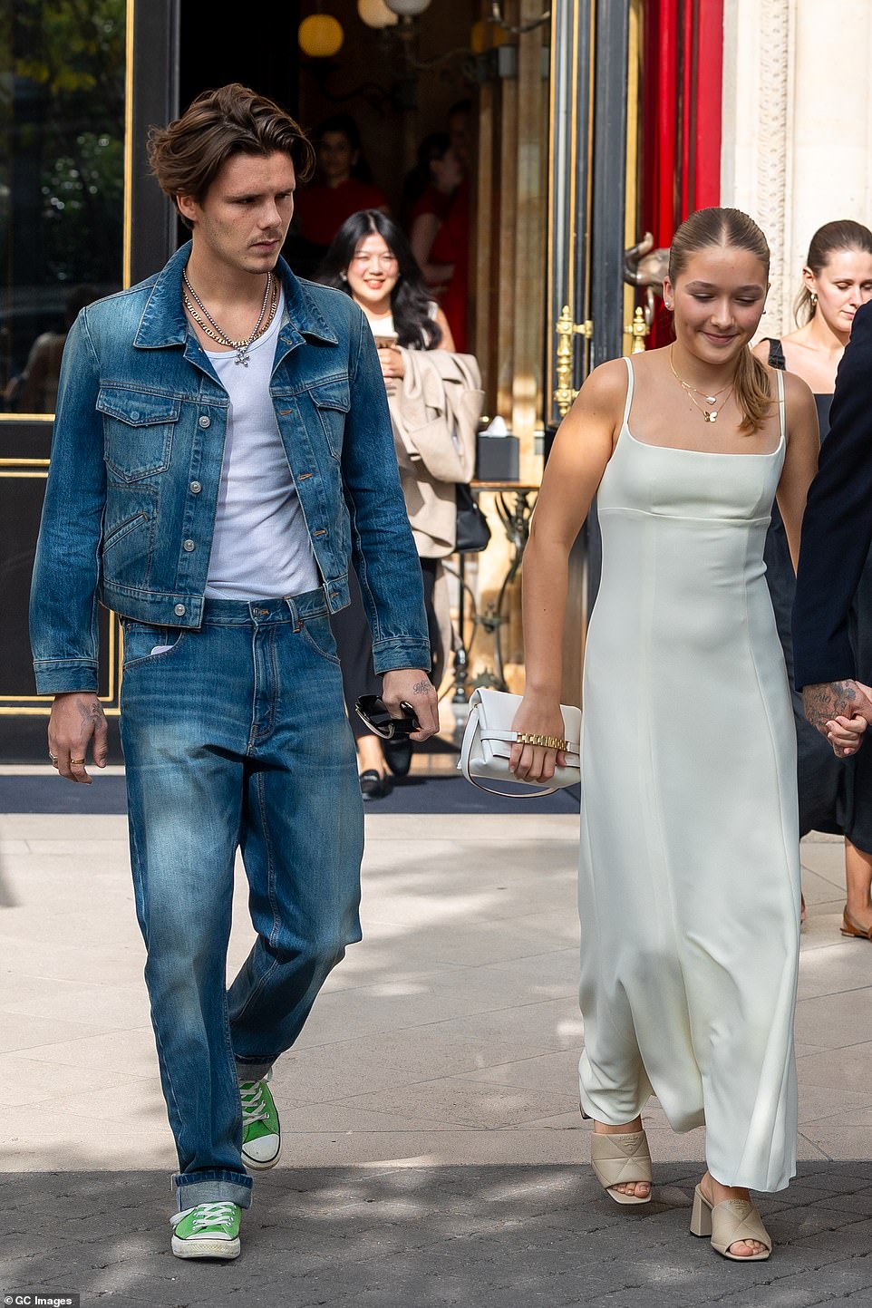 Looking good: Also making his way to the show was Cruz, 18, who paid homage to the Nineties in double denim, pairing a jacket and jeans with green Converse shoes