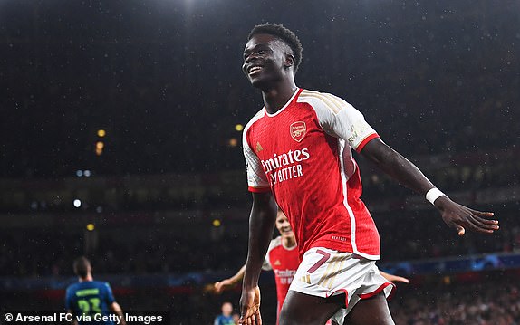 LONDON, ENGLAND - SEPTEMBER 20: Bukayo Saka of Arsenal celebrates after scoring the team's first goal during the UEFA Champions League match between Arsenal FC and PSV Eindhoven at Emirates Stadium on September 20, 2023 in London, England. (Photo by David Price/Arsenal FC via Getty Images)