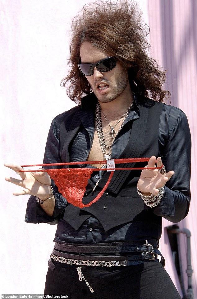 Russell Brand plays with a pair of knickers during a photo shot in Hollywood in 2008