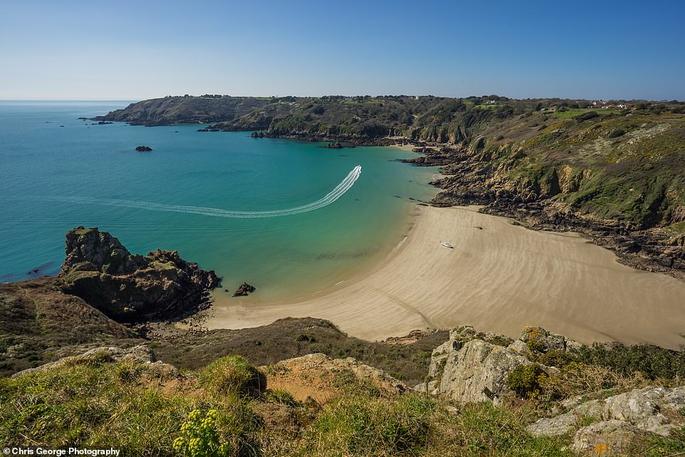 There are plenty of reasons to visit Guernsey - including the fact that it has 27 beautiful beaches to discover. Above is Guernsey's stunning Saints Bay
