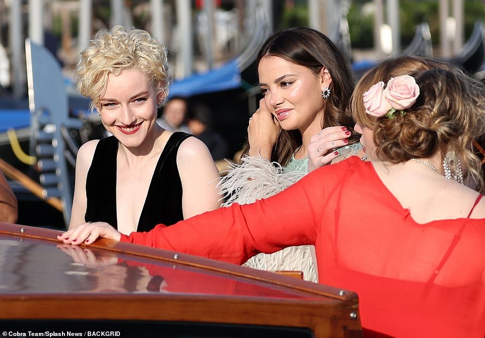 Glam: Julia was beaming as she climbed on to a boat with actress Keleigh Sperry, who is married to Miles Teller