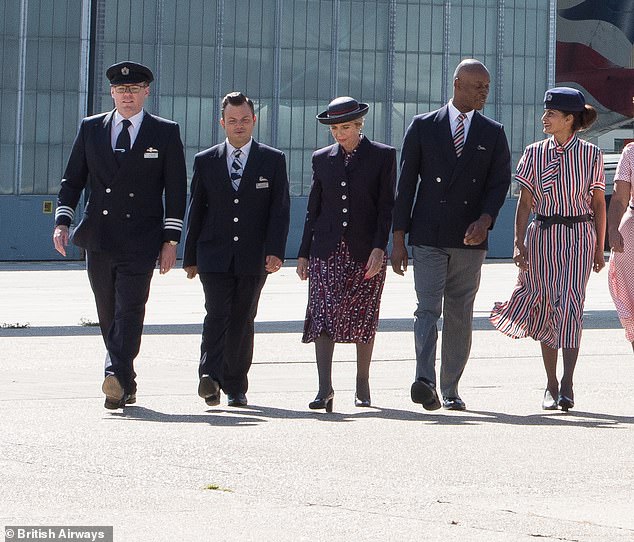 The design shown by the man and woman on the far right shows the double-breasted blazer which pilots were allowed to wear for the first time