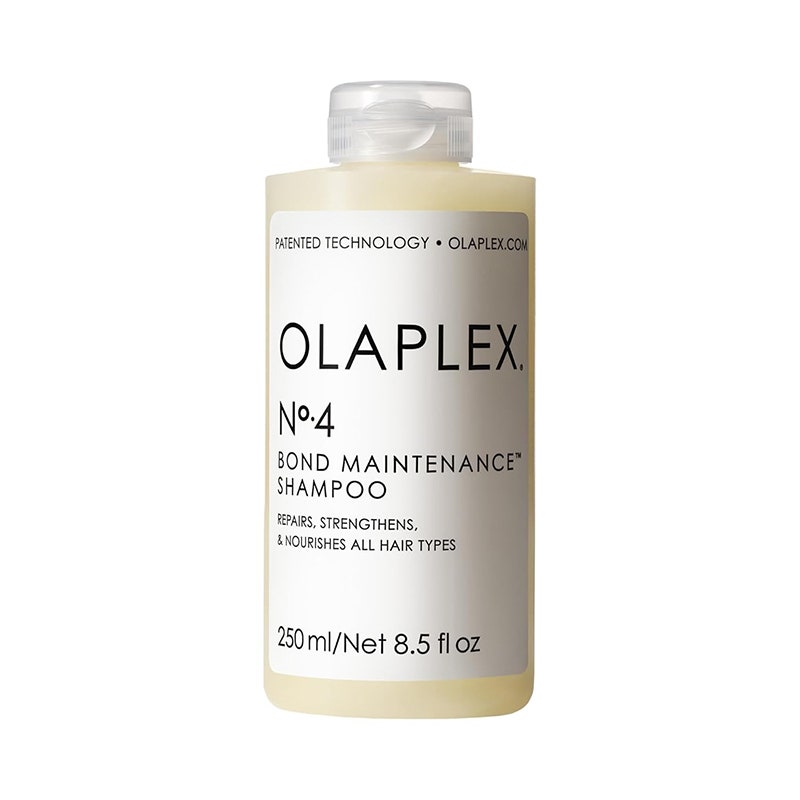 Olaplex Nr. 4 Bond Maintenance Shampoo: Eine klare Shampooflasche mit weißem Etikett und schwarzem Text auf weißem Hintergrund