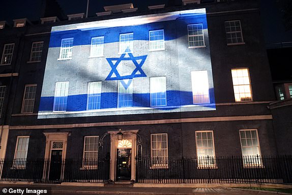 LONDON, ENGLAND - OCTOBER 08: Israel's flag is projected onto the front of 10 Downing Street in a show of support on October 08, 2023 in London, England. After Hamas began rocket and ground attacks on Israel yesterday, the UK Prime Minister condemned the attack and offered Israel unequivocal support.  (Photo by Justin Palmer/Getty Images)