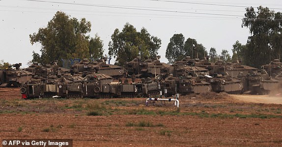 Israeli army reinforcements take position outside the southern city of Sderot near the border with Gaza on October 9, 2023. Israel continued to battle Hamas fighters on October 9 and massed tens of thousands of troops and heavy armour around the Gaza Strip after vowing a massive blow over the Palestinian militants' surprise attack. (Photo by Jack Guez / AFP) (Photo by JACK GUEZ/AFP via Getty Images)