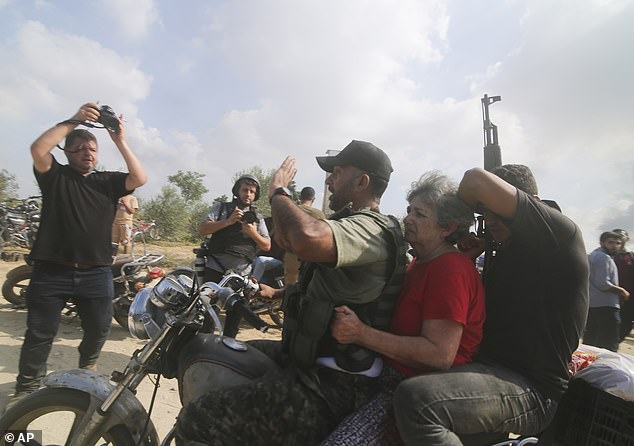 One would think that U.S. women in power would stand up for other women and girls who are being brutalized as we speak. But no. Never underestimate the ability of the hard-Left to sink beneath subterranean depths. (Pictured: Hamas terrorists capture an elderly Israeli woman).