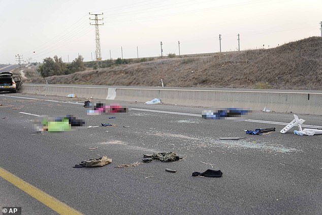 bodies are seen strewn across the road near Sderot, Israel, on Saturday, Oct. 7, 2023