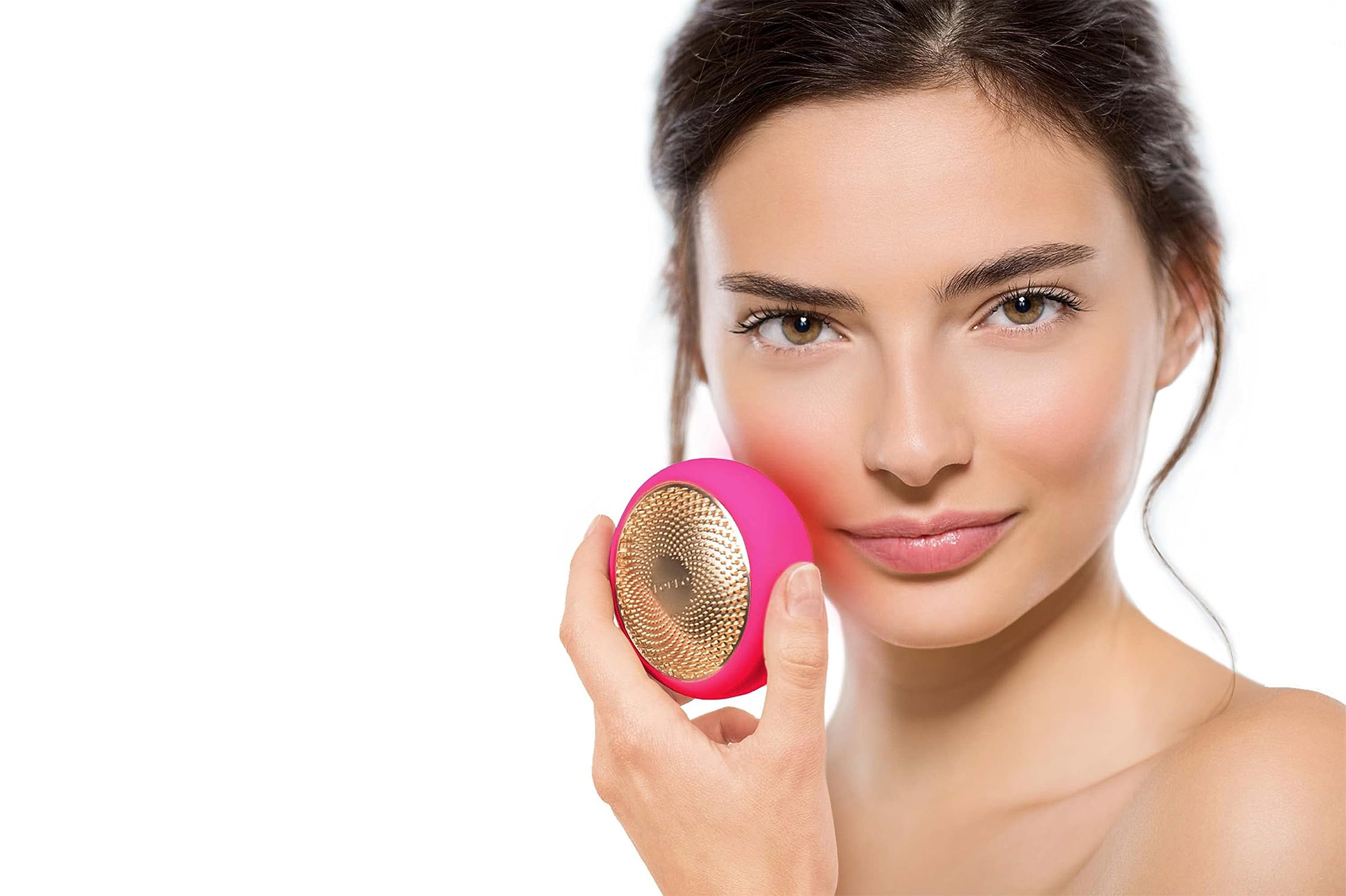 A model using a pink Foreo LED tool