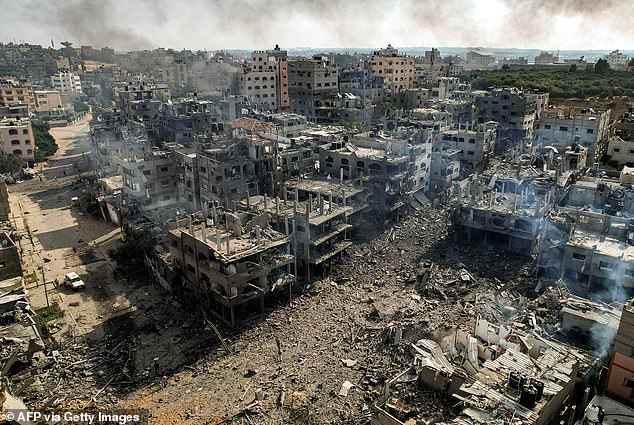 This picture taken on October 11, 2023 shows an aerial view of buildings destroyed by Israeli air strikes in the Jabalia camp for Palestinian refugees in Gaza City