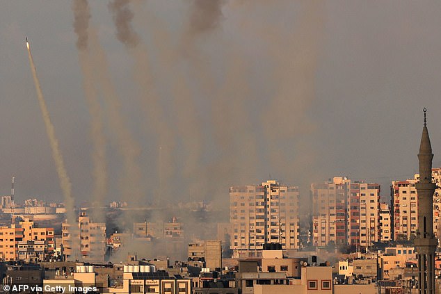 A salvo of rockets is fired by Palestinian militants from Gaza towards Israel as the war's death toll passed 3,000