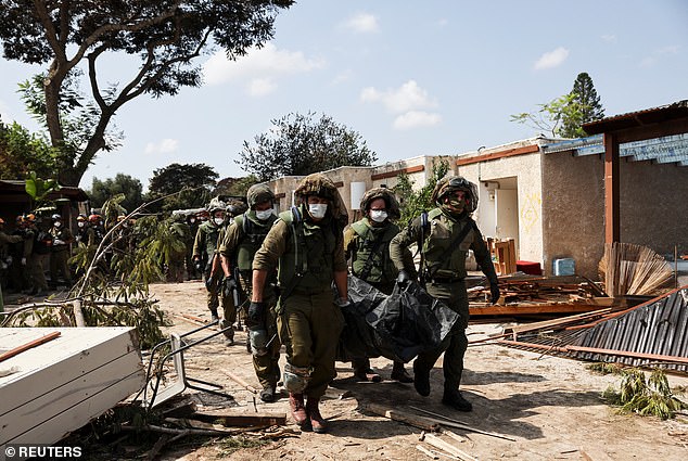 Hamas terrorists gunned down entire families in their homes in a small kibbutz in Israel, Israeli soldiers have claimed
