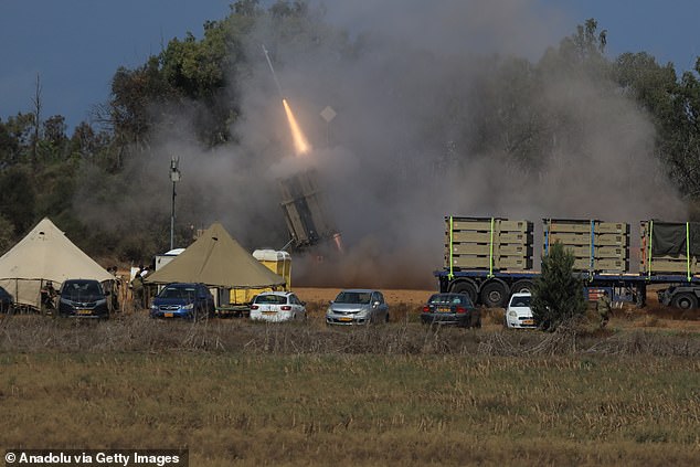 Rockets fired from Gaza are seen being intercepted by the Iron Dome protection system