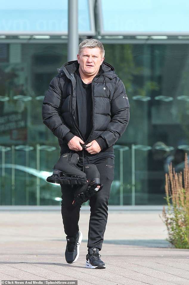 Focused: Ricky Hatton looked like he was in the zone as he left the rink carrying his skates