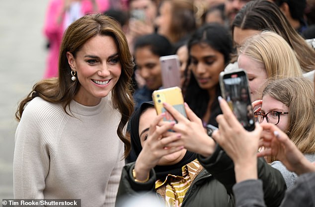 After enjoying a chat with the royal fan who had gathered to meet her, Kate happily posed for a selfie