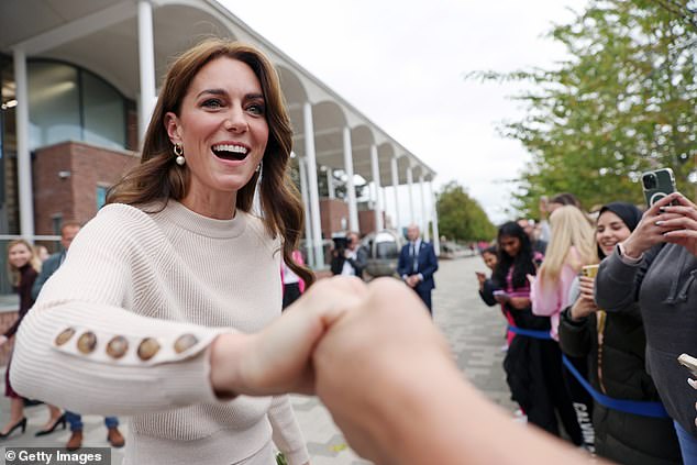 The Princess took the hand of one of the well wishers who had queued up outside the university to say hello