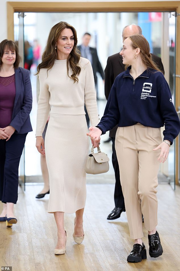 Princess Kate was led into the student union by officials at the university