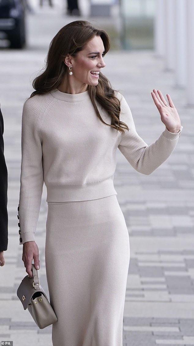 Princess Kate wore her thick brunette locks tucked behind one ear and styled in loose, cascading curls