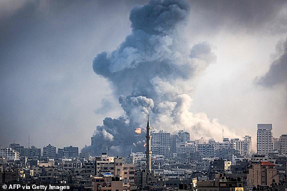 TOPSHOT - Smoke plumes billow during Israeli air strikes in Gaza City on October 12, 2023 as raging battles between Israel and the Hamas movement continue for the sixth consecutive day. Washington urged Israel to show restraint in its response to Hamas's surprise attack -- the worst in the country's 75-year history -- which Israeli forces said killed more than 1,200 people, mostly civilians. In Gaza, officials have reported more than 1,200 people killed in Israel's uninterrupted campaign of air and artillery strikes, while the UN said more than 338,000 people have been displaced. (Photo by IBRAHIM HAMS / AFP) (Photo by IBRAHIM HAMS/AFP via Getty Images)