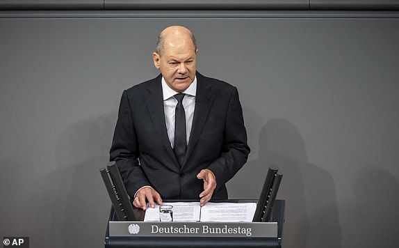 German Chancellor Olaf Scholz delivers a government statement on the situation in Israel during a meeting of the German federal parliament, Bundestag, at the Reichstag building in Berlin, Germany, Thursday, Oct. 12, 2023. (Michael Kappeler/dpa via AP)