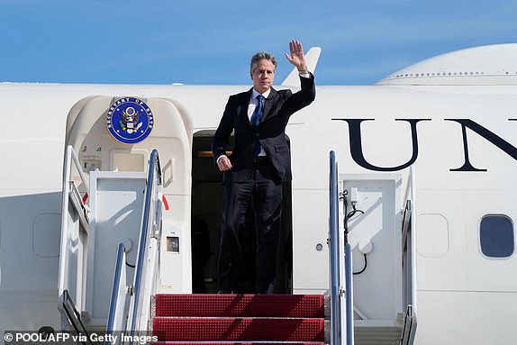 US Secretary of State Antony Blinken waves as he boards a plane, October 11, 2023, at Andrews Air Force Base, Maryland, en route to Israel. President Joe Biden is dispatching his top diplomat to Israel on an urgent mission to show US support after the unprecedented attack by Hamas militants. (Photo by Jacquelyn Martin / POOL / AFP) (Photo by JACQUELYN MARTIN/POOL/AFP via Getty Images)