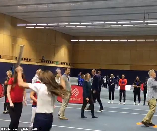 Competitive Kate! The mother-of-three jubilantly punched the air after scoring in the netball drill
