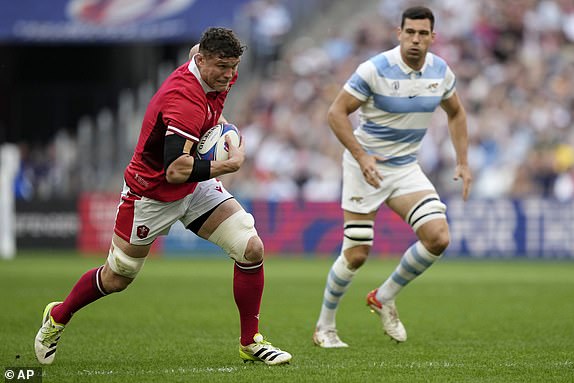 Wales' Will Rowlands runs with the ball during the Rugby World Cup quarterfinal match between Wales and Argentina at the Stade de Marseille in Marseille, France, Saturday, Oct. 14, 2023. (AP Photo/Lewis Joly)
