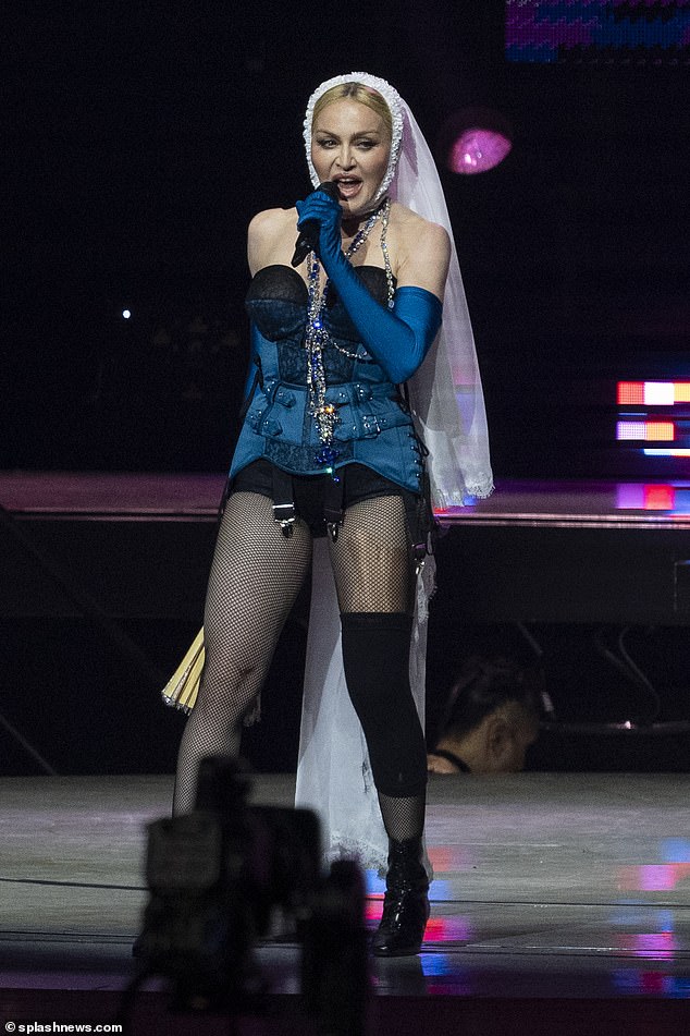 Creative: Madonna paired an iconic bridal veil with a striking blue corset