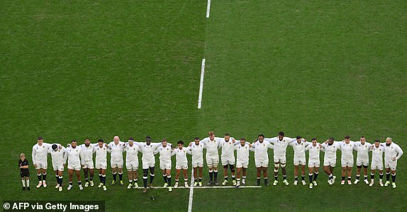 English players line up ahead of the France 2023 Rugby World Cup quarter-final match between England and Fiji at the Velodrome stadium in Marseille, south-eastern France, on October 15, 2023. (Photo by NICOLAS TUCAT / AFP) (Photo by NICOLAS TUCAT/AFP via Getty Images)