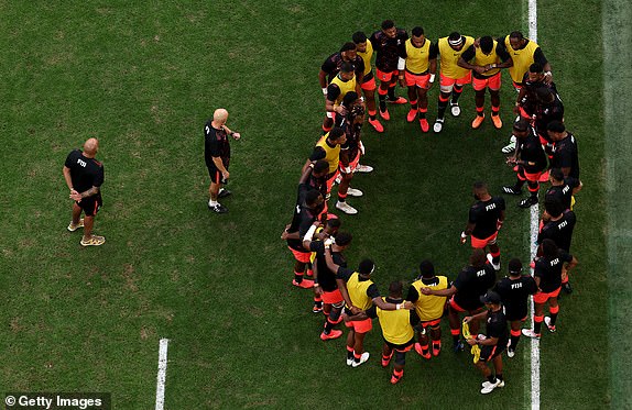 MARSEILLE, FRANCE - OCTOBER 15: The players of Fiji form a huddle prior to kick-off ahead of the Rugby World Cup France 2023 Quarter Final match between England and Fiji at Stade Velodrome on October 15, 2023 in Marseille, France. (Photo by Cameron Spencer/Getty Images)