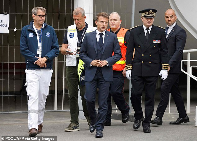 French President Emmanuel Macron (centre) is pictured arriving at the Gambetta high school in Arras