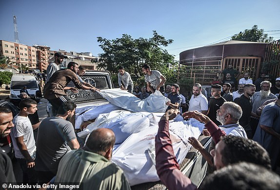 KHAN YUNIS, GAZA - OCTOBER 18: The bodies of Palestinians who lost their lives due to Israeli air strikes are being transported for burial from the Nassr hospital in Khan Yunis, Gaza on October 18, 2023. (Photo by Abed Zagout/Anadolu via Getty Images)