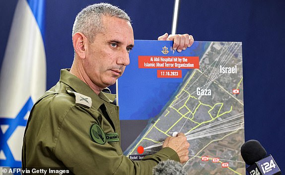 Israeli army spokesman Rear Admiral Daniel Hagari speaks to the press from The Kirya, which houses the Israeli Ministry of Defence, in Tel Aviv on October 18, 2023. At least 200 people were killed in an air strike on a hospital compound that sheltered the wounded and displaced from Israeli bombing, local health officials said on October 18, prompting global condemnation and fury. Spokesman Hagari told a press briefing that at the time of the strike, the Israeli army was not conducting air operations near the hospital and the rockets that hit the building did not match theirs. (Photo by GIL COHEN-MAGEN / AFP) (Photo by GIL COHEN-MAGEN/AFP via Getty Images)