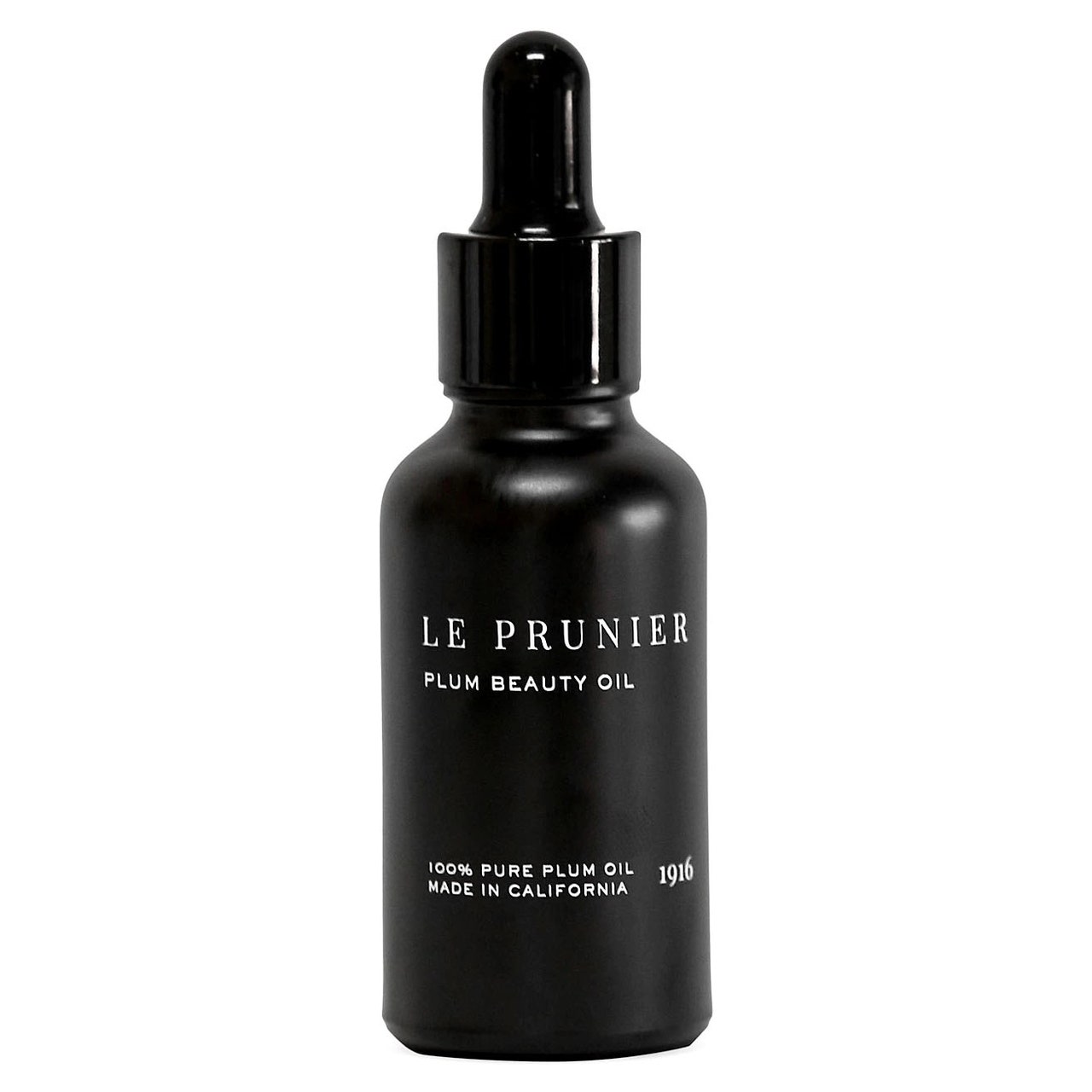 Le Prunier Plum Beauty Oil schwarze Flasche auf weißem Hintergrund