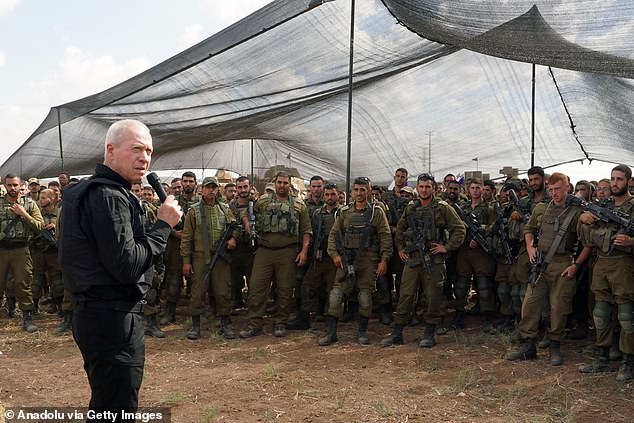 Israeli Defense Minister Yoav Gallant speaks during his visit to Israeli soldiers near the Gaza border on Thursday