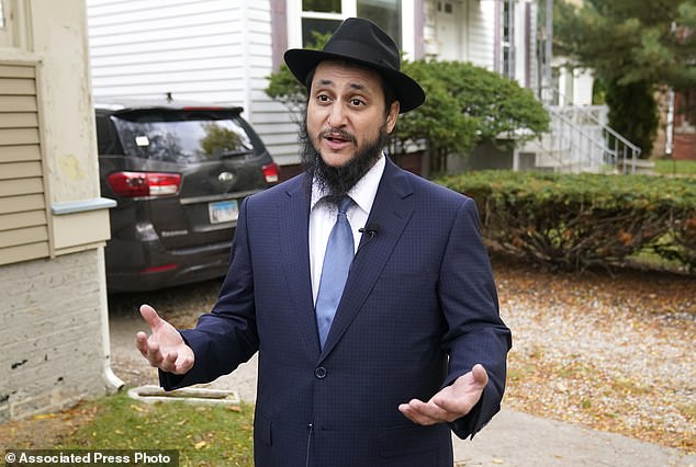 Rabbi Meir Hecht with Chabad of Evanston, talks with reporters outside his home about the release of Judith Raanan and her daughter Natalie