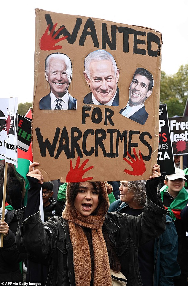 People take part in a 'March For Palestine', in London on October 21